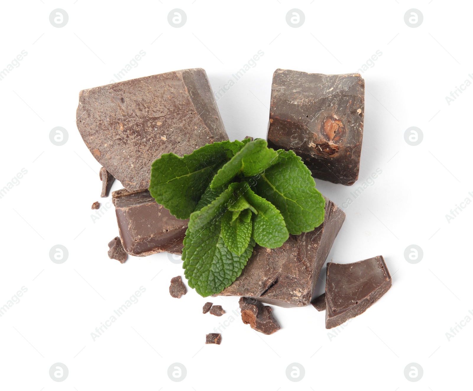 Photo of Tasty dark chocolate pieces with mint on white background, top view