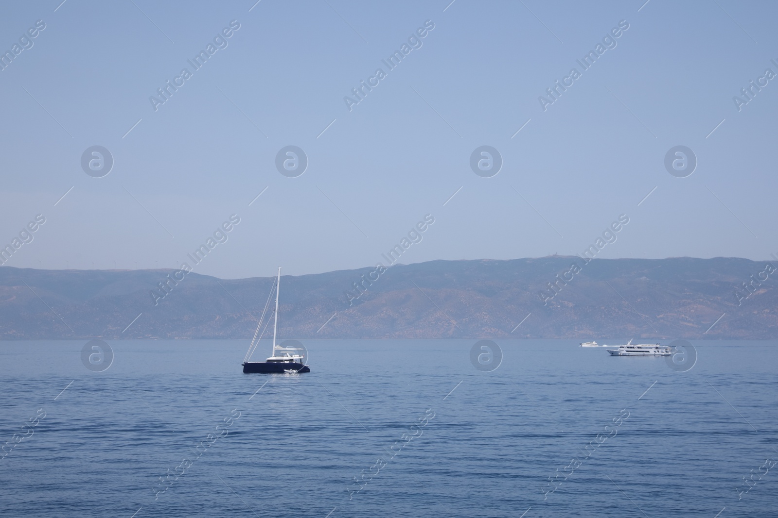 Photo of Beautiful seascape with boats and distant shore