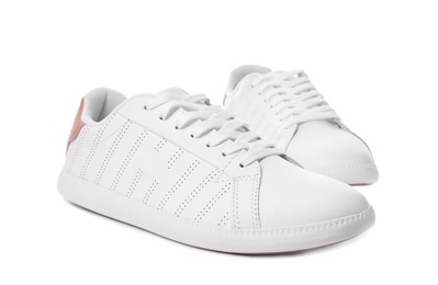 Photo of Pair of trendy sneakers on white background