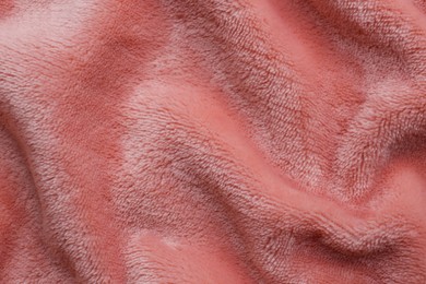 Photo of Soft pink fabric as background, top view