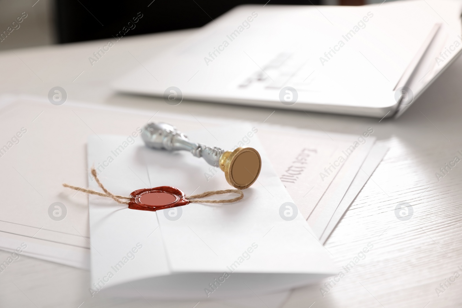 Photo of Vintage notary stamp and documents on desk, closeup