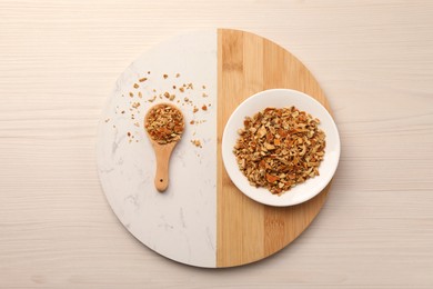 Photo of Tray with dried orange zest seasoning on wooden table, top view