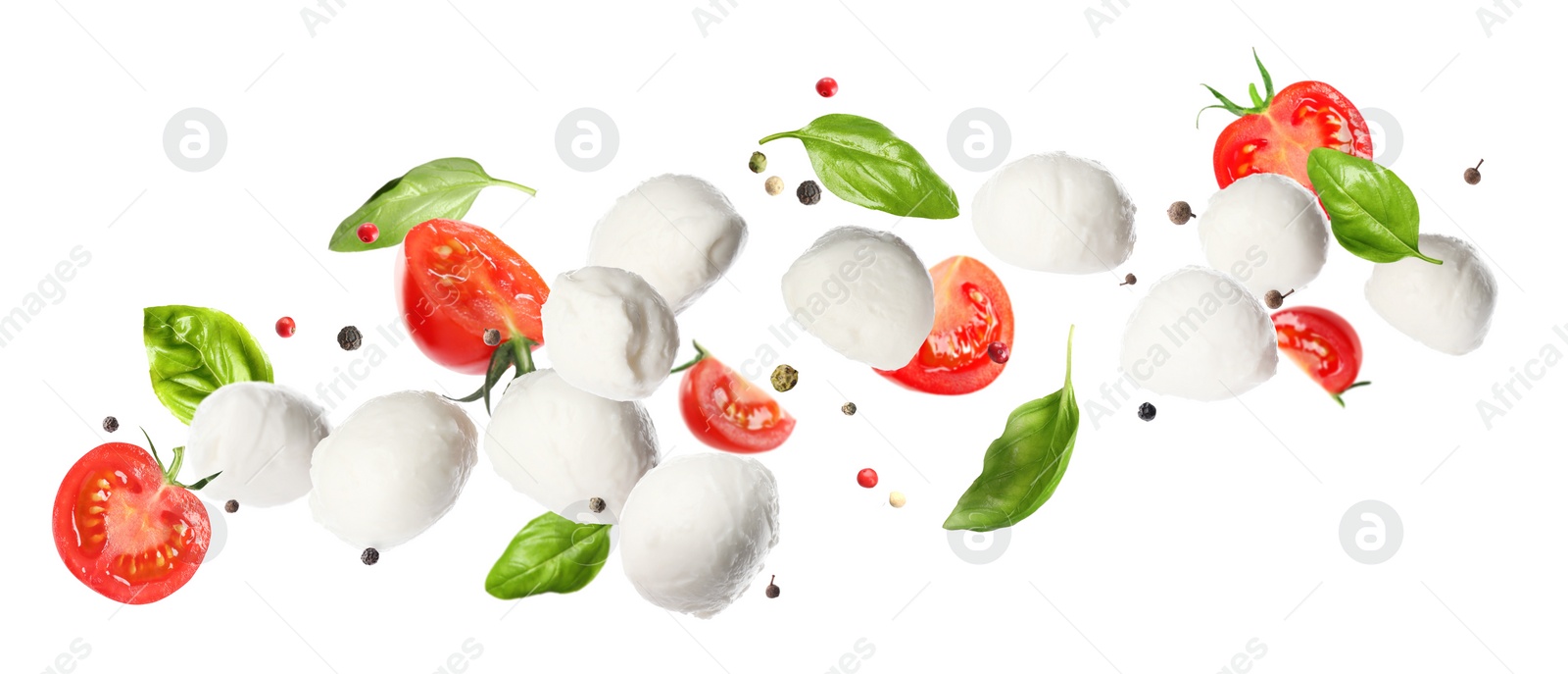 Image of Mozzarella cheese balls, tomatoes, basil leaves and peppercorns for caprese salad flying on white background. Banner design