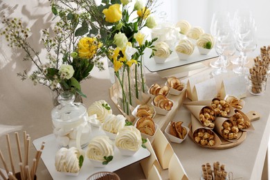 Tasty treats on table in room. Sweet buffet