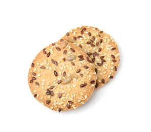 Photo of Round cereal crackers with flax, sunflower and sesame seeds isolated on white, top view