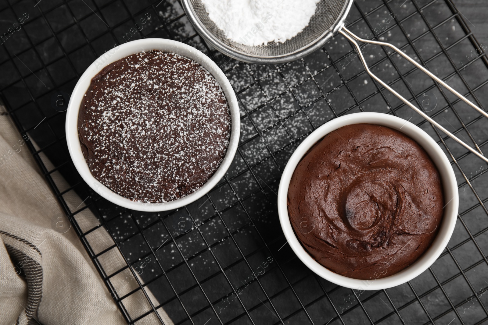 Photo of Delicious fresh chocolate fondant on black table, flat lay
