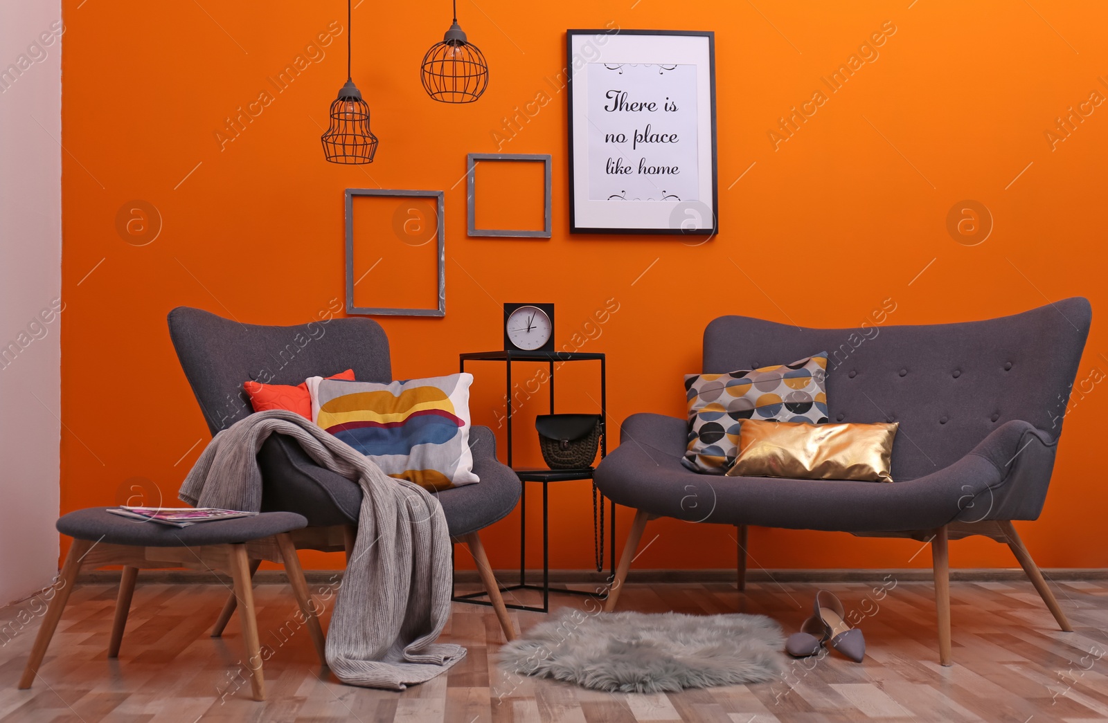 Photo of Modern apartment with comfortable armchair and sofa