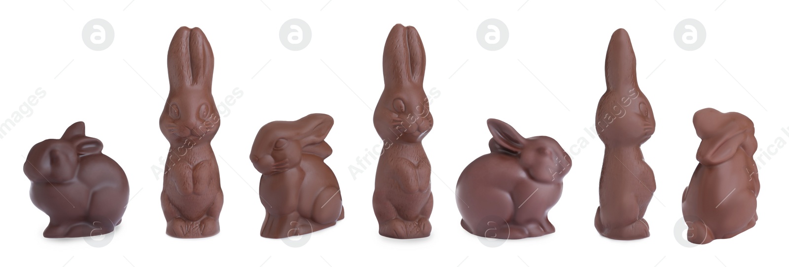 Image of Set with chocolate Easter bunnies on white background, banner design 