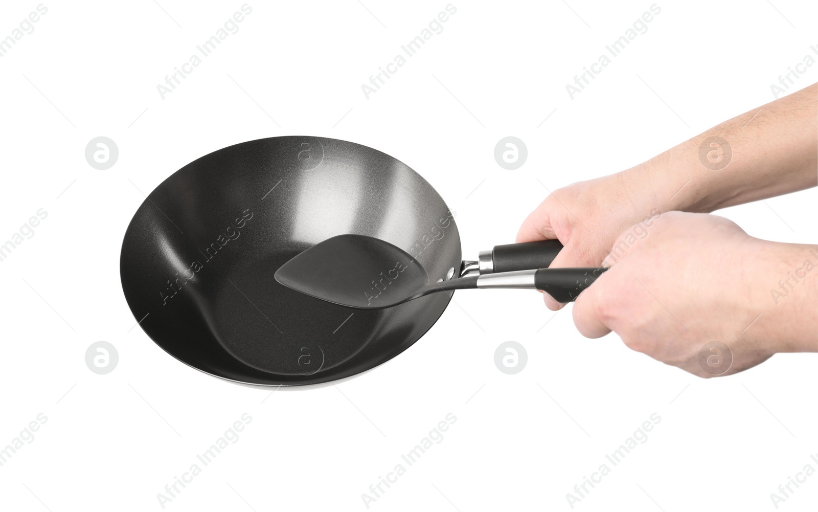 Photo of Man holding empty metal wok on white background, closeup