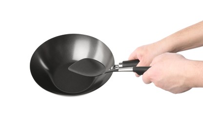 Photo of Man holding empty metal wok on white background, closeup