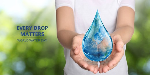 World Water Day. Woman holding icon of drop with Earth image inside on blurred green background, closeup