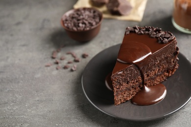 Photo of Delicious fresh chocolate cake served on grey table