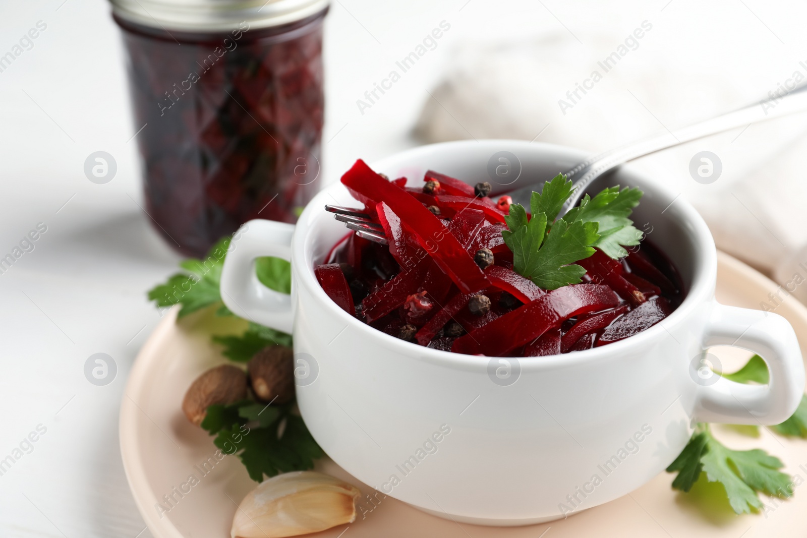 Photo of Delicious pickled beets and spices on table, closeup