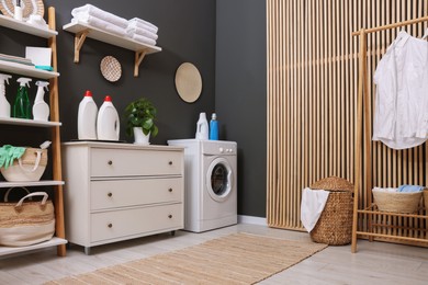 Laundry room interior with washing machine and furniture