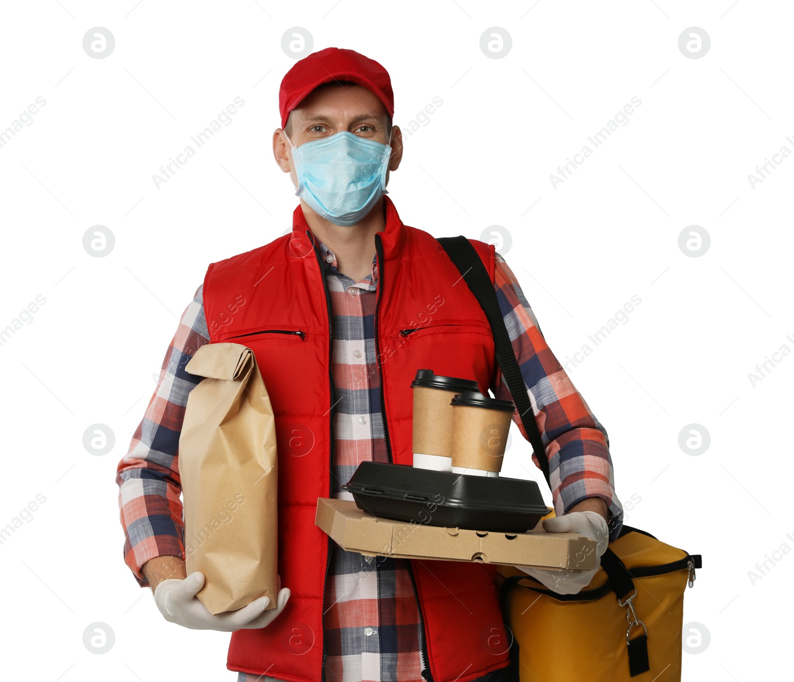 Photo of Courier in protective mask and gloves holding order on light background. Food delivery service during coronavirus quarantine