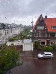 Photo of Window glass with water drops, view from inside. Rainy weather