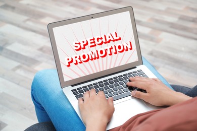 Special Promotion. Man using laptop indoors, closeup