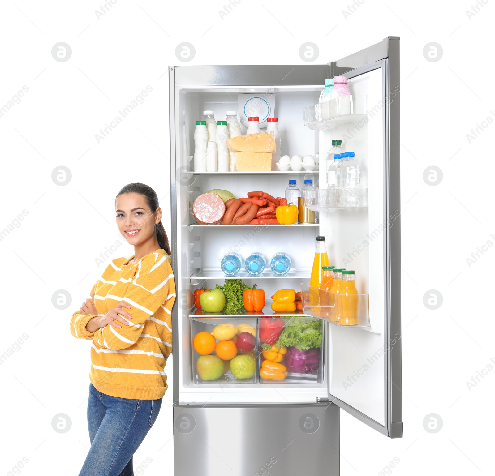 Photo of Young woman near open refrigerator on white background