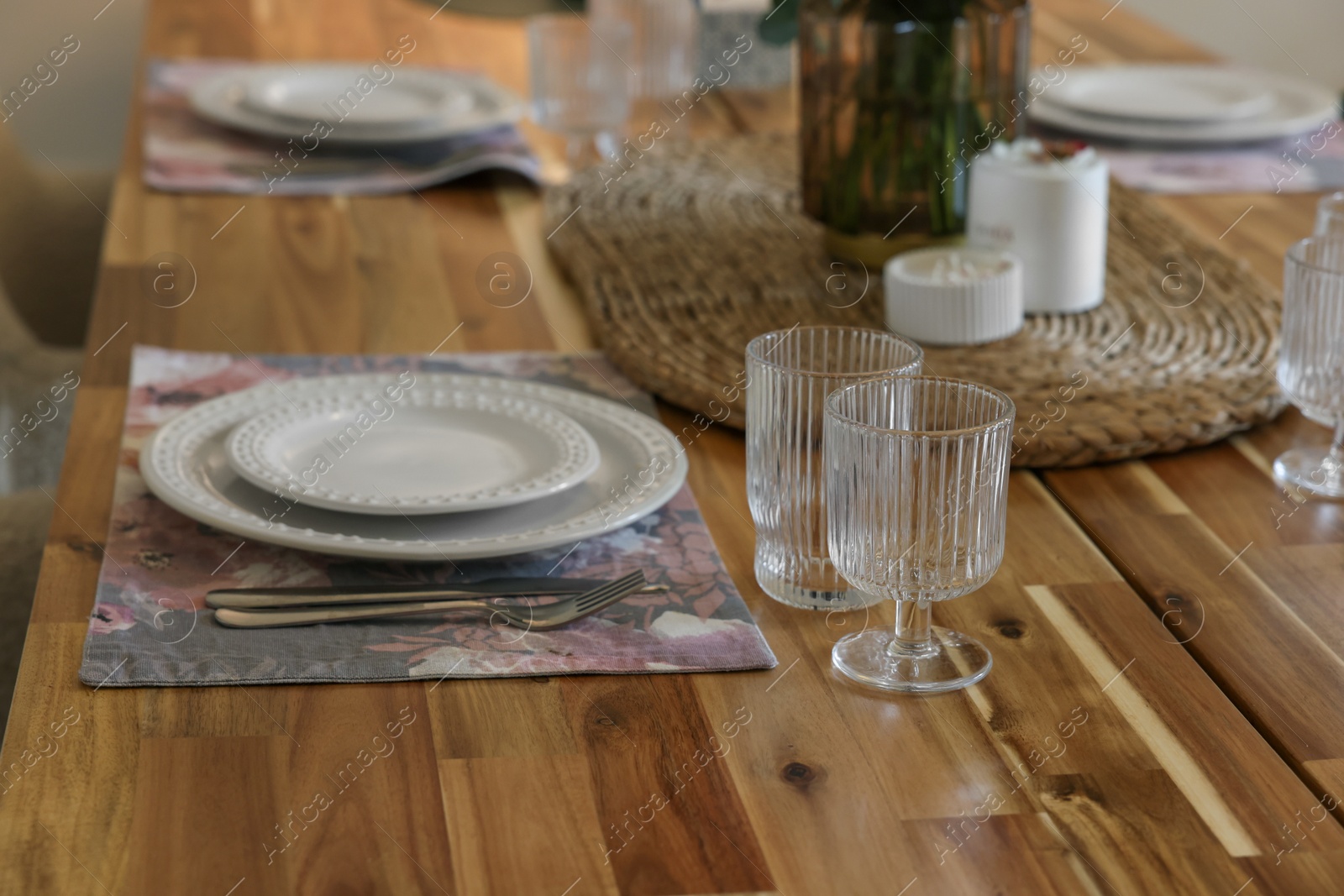 Photo of Beautiful table setting. Plates, cutlery, glasses and napkin