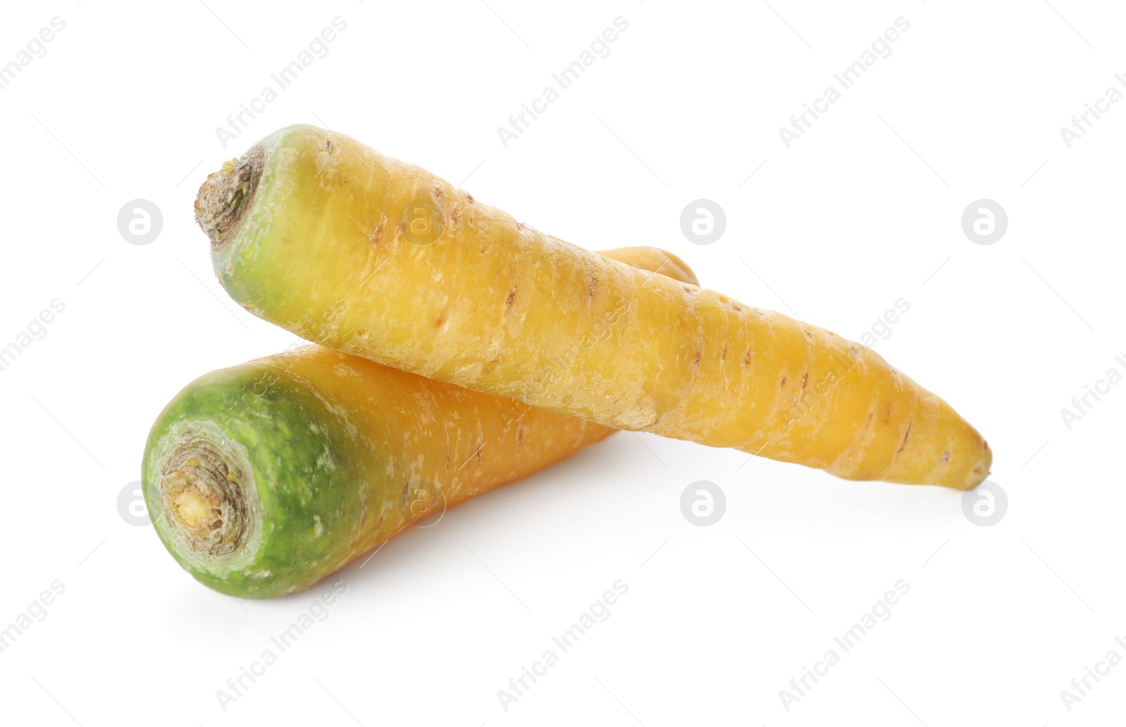 Photo of Fresh raw yellow carrots isolated on white