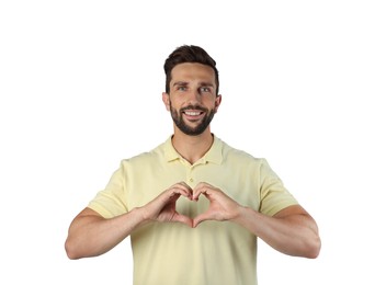 Photo of Happy man making heart with hands on white background