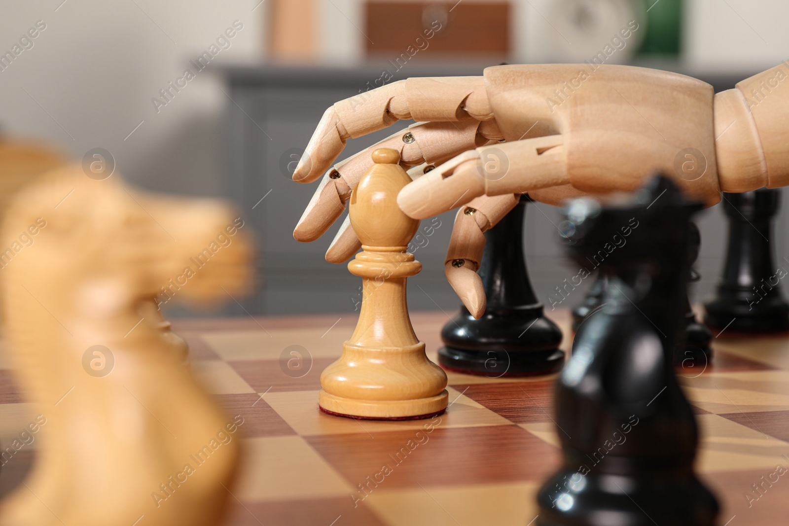 Photo of Robot moving chess piece on board, closeup. Wooden hand representing artificial intelligence