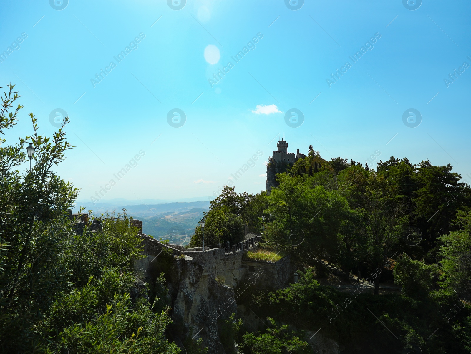 Photo of Picturesque view of castle near trees on sunny day