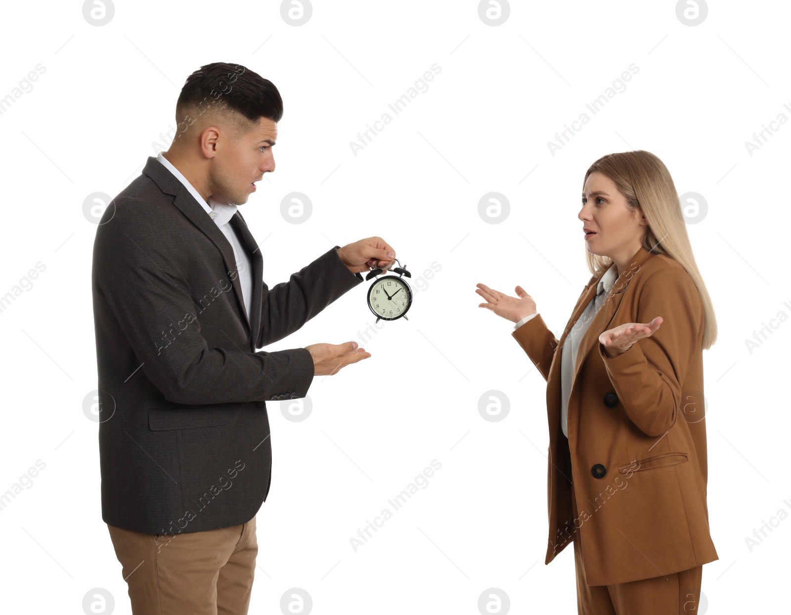 Photo of Businessman with alarm clock scolding employee for being late on white background