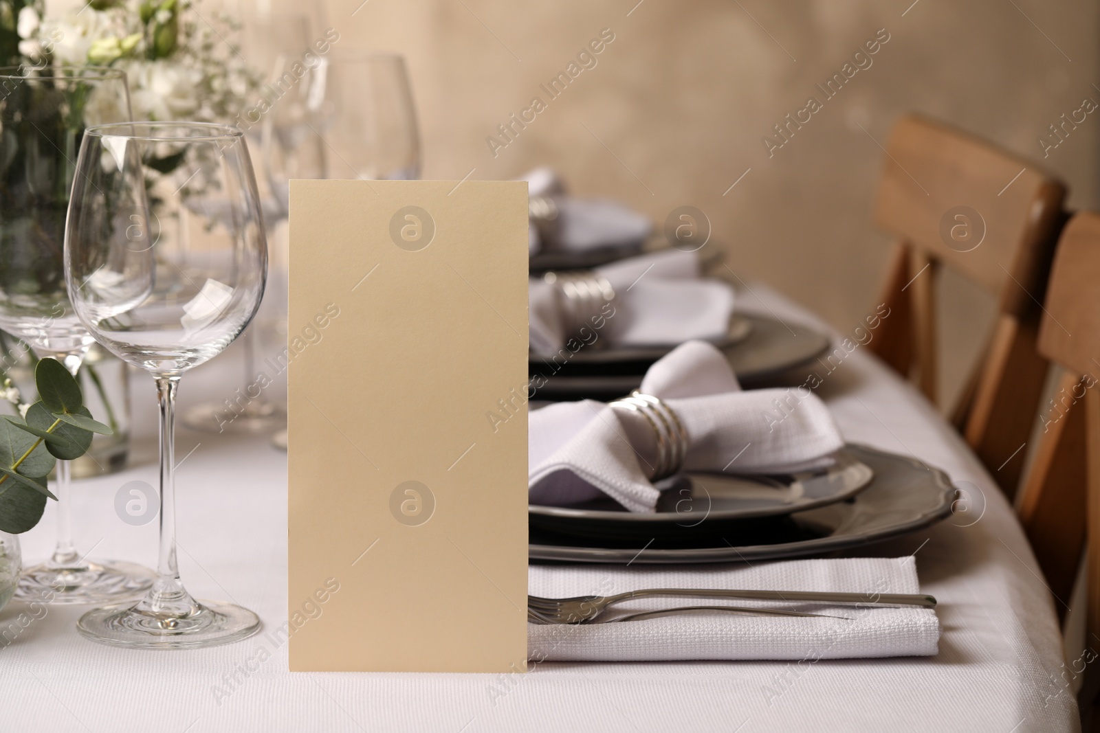 Photo of Stylish elegant table setting for festive dinner in restaurant