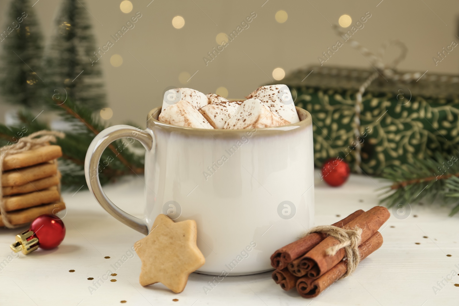 Photo of Composition with delicious marshmallow cocoa on wooden table