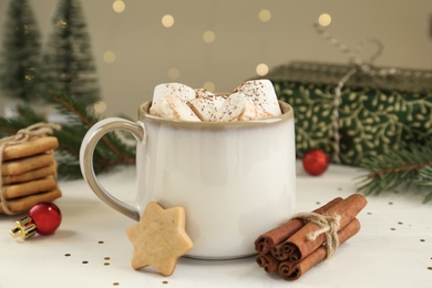 Photo of Composition with delicious marshmallow cocoa on wooden table