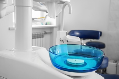 Photo of Clean spit sink in modern dentist's office
