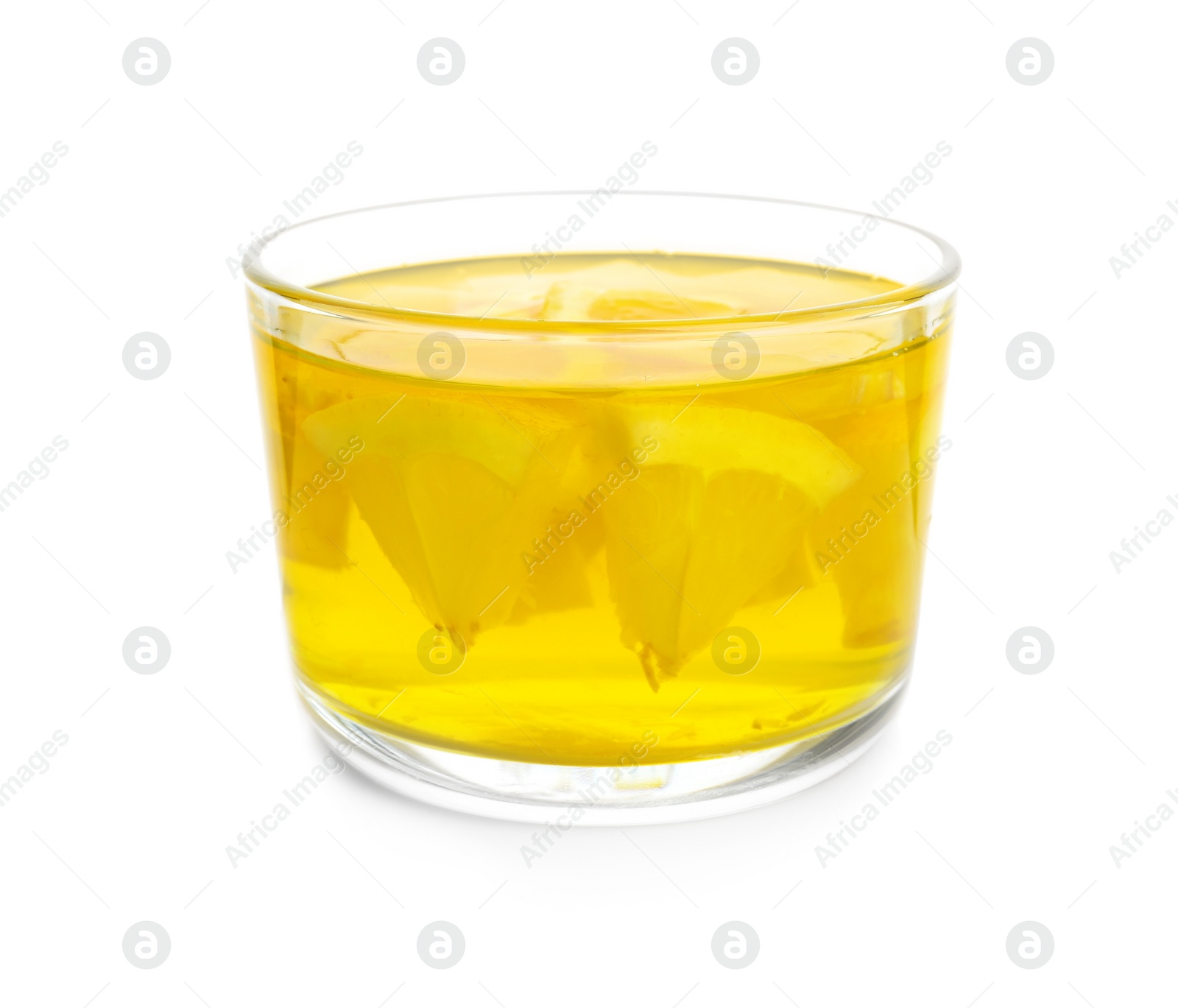 Photo of Tasty jelly dessert with slices of lemon in glass on white background