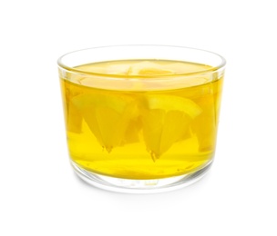 Photo of Tasty jelly dessert with slices of lemon in glass on white background