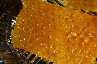 Natural honeycombs with tasty honey on blurred background, closeup