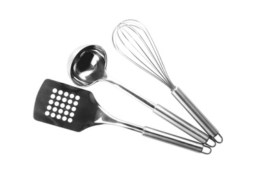 Different stainless steel kitchen utensils on white background