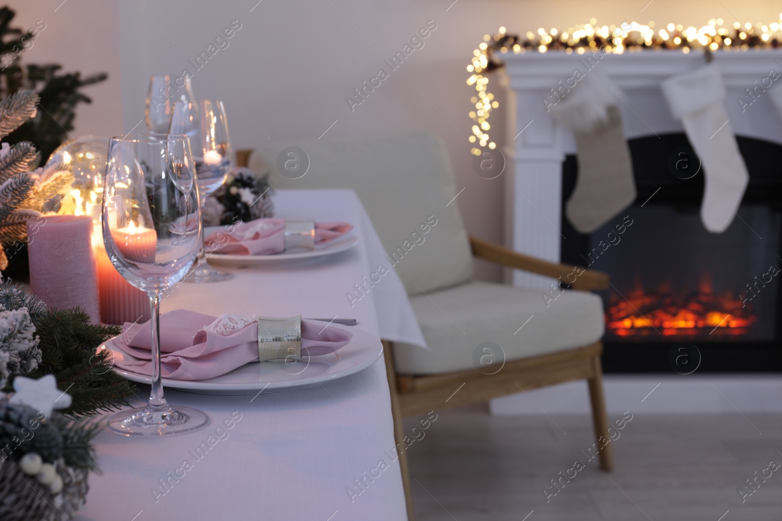 Photo of Beautiful festive table setting with Christmas decor in room, space for text