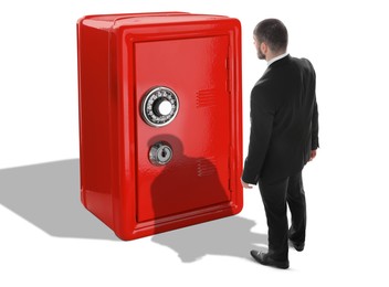 Financial security, keeping money. Thoughtful businessman standing in front of big red steel safe on white background