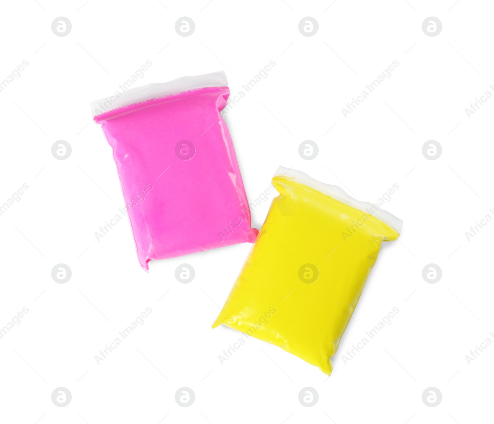 Photo of Packages of colorful play dough on white background, top view