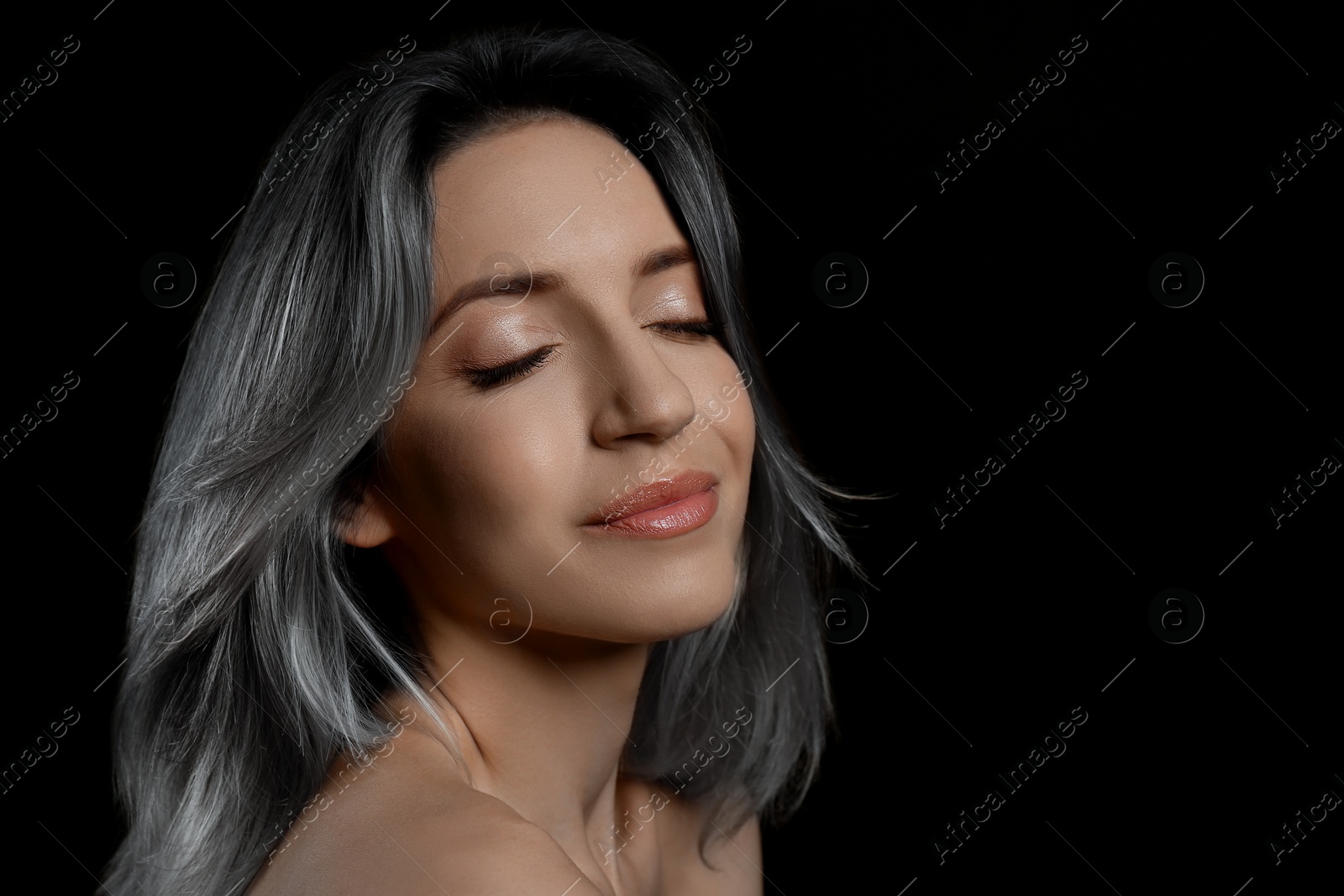 Image of Beautiful woman with ash hair color on black background. Space for text