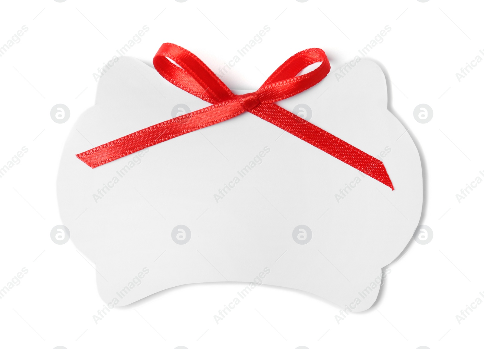 Photo of Blank gift tag with satin ribbon on white background, top view