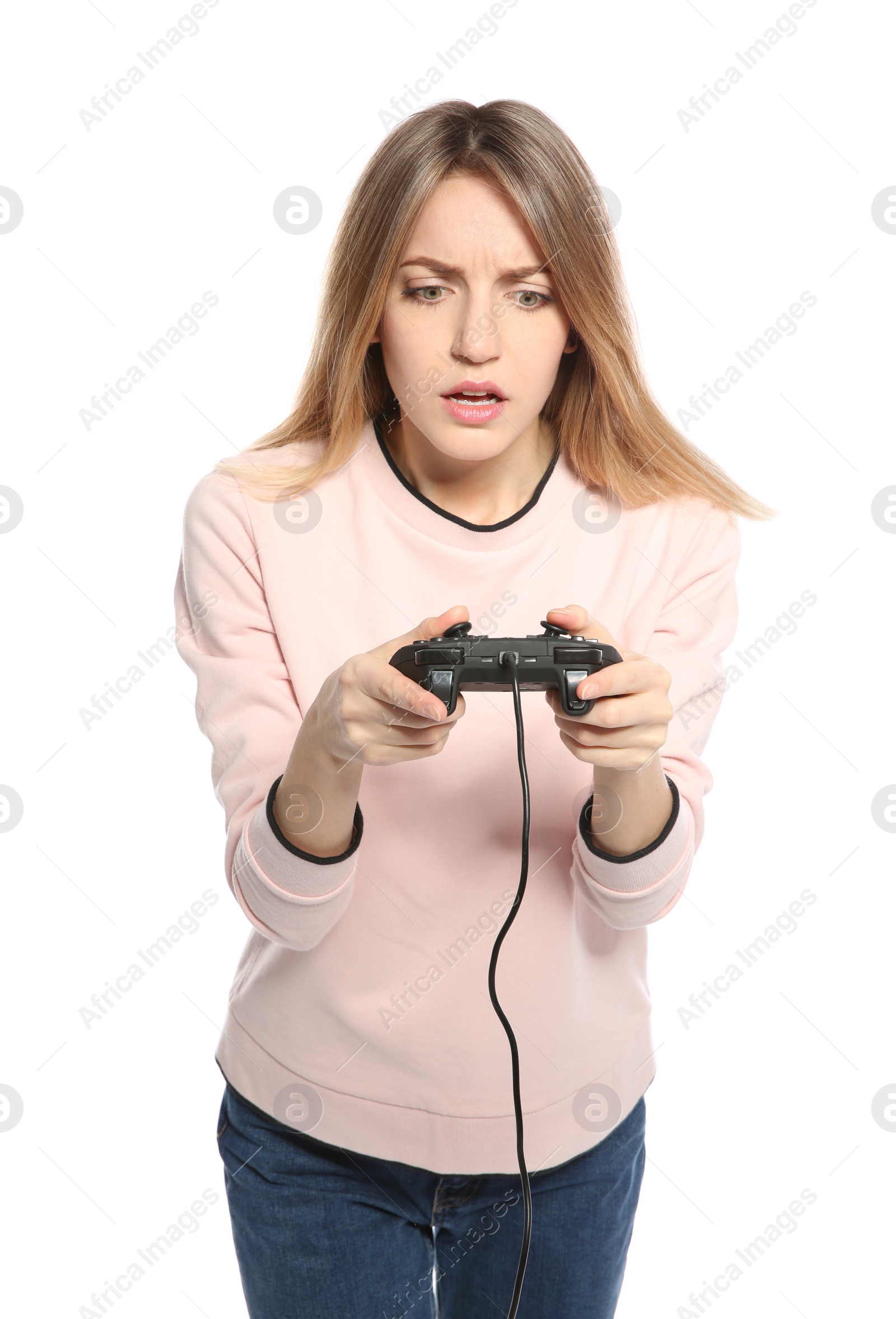 Photo of Emotional young woman playing video games with controller isolated on white