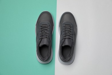 Pair of stylish sport shoes on color background, flat lay