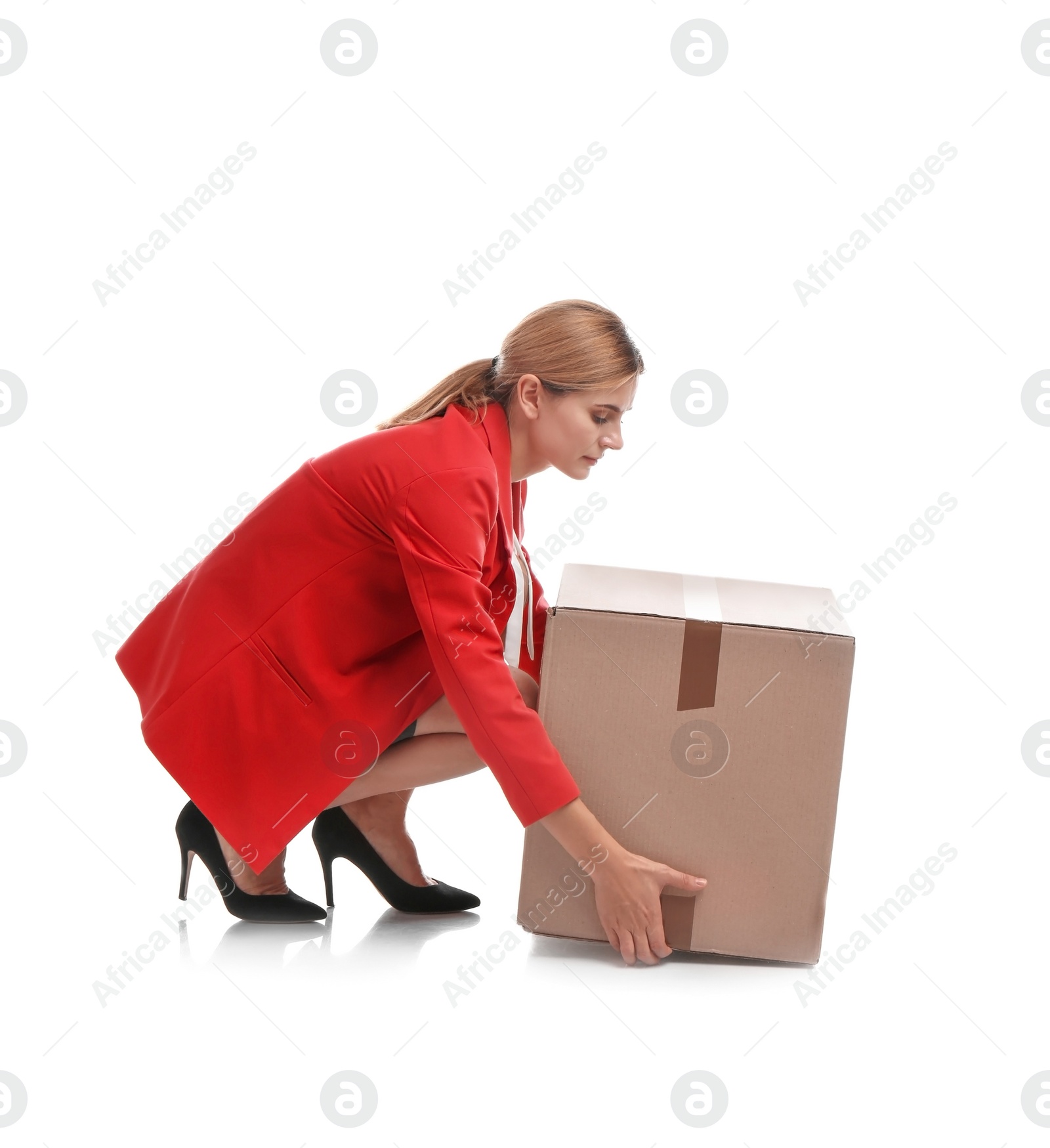 Photo of Full length portrait of woman lifting carton box on white background. Posture concept
