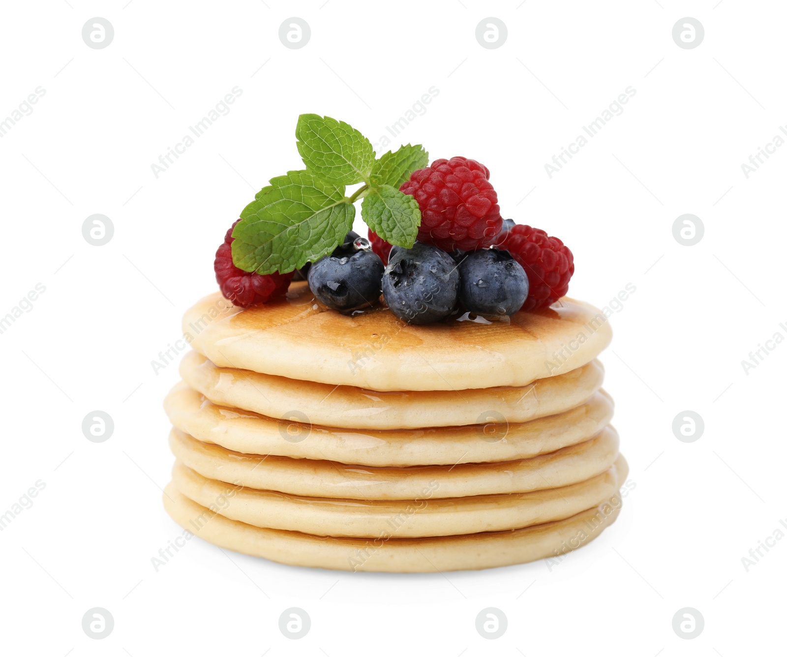 Photo of Delicious pancakes with berries, honey and mint isolated on white