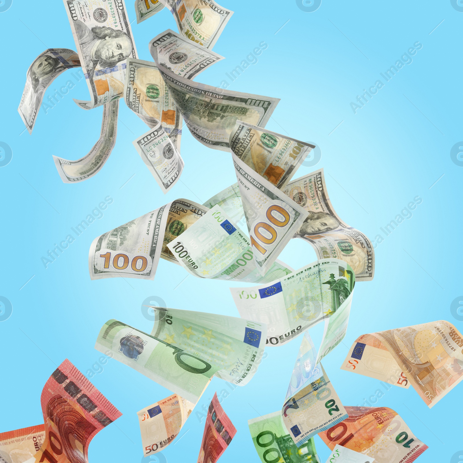 Image of Money exchange. Dollars turning into euro banknotes while falling on light blue background