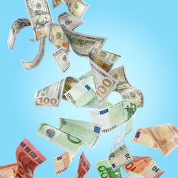 Image of Money exchange. Dollars turning into euro banknotes while falling on light blue background