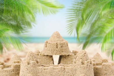 Sand castle on ocean beach, closeup. Outdoor play