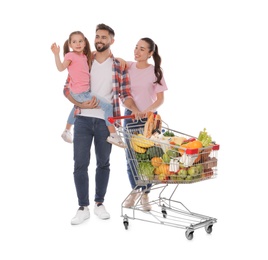 Photo of Happy family with shopping cart full of groceries on white background