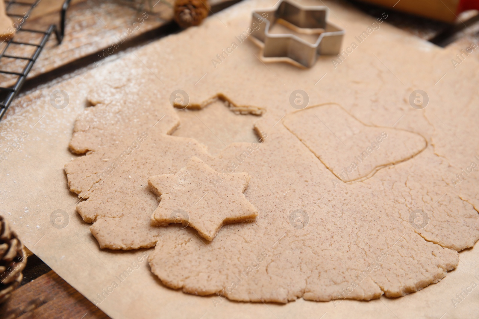 Photo of Homemade Christmas biscuits. Dough and cookie cutter on table, closeup